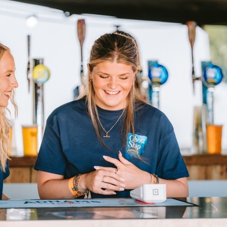 Bar staff smiling