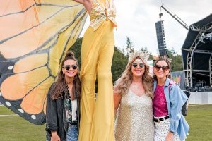 Guests with Stilt Walkers at Classic Ibiza Tatton 2023