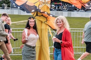 Guests with Stilt Walkers at Classic Ibiza Tatton 2023