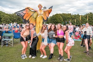 Guests with Stilt Walkers at Classic Ibiza Tatton 2023