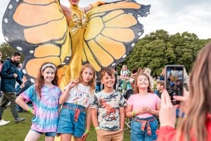 Guests with Stilt Walkers at Classic Ibiza Tatton 2023